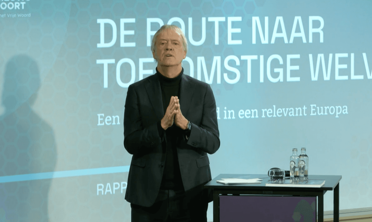 Peter Wennink presenting his report on December 12, 2025