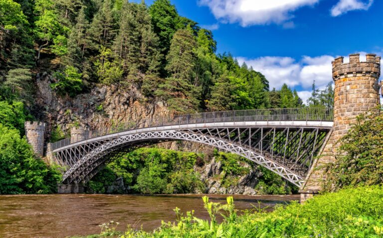 Bridge over river between two stone tower supports